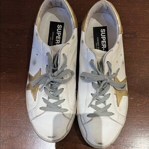 Golden Goose Women's Super Star Sneakers in White and Gold